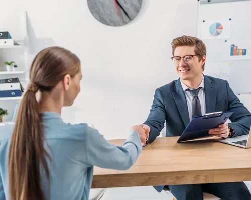 depositphotos_254316912-stock-photo-woman-shaking-hands-cheerful-recruiter